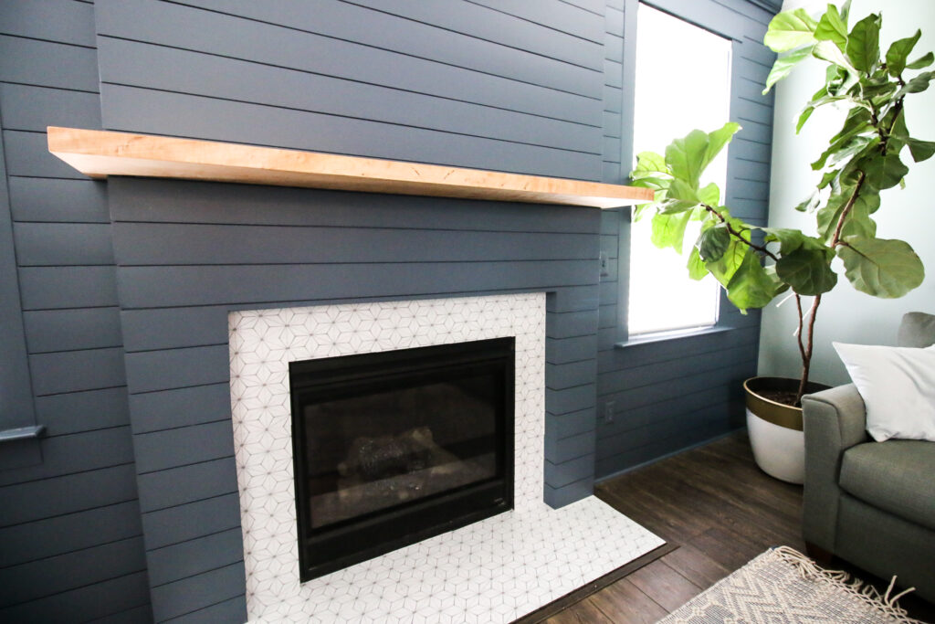 Black Shiplap Fireplace with a Contrasting White Marble