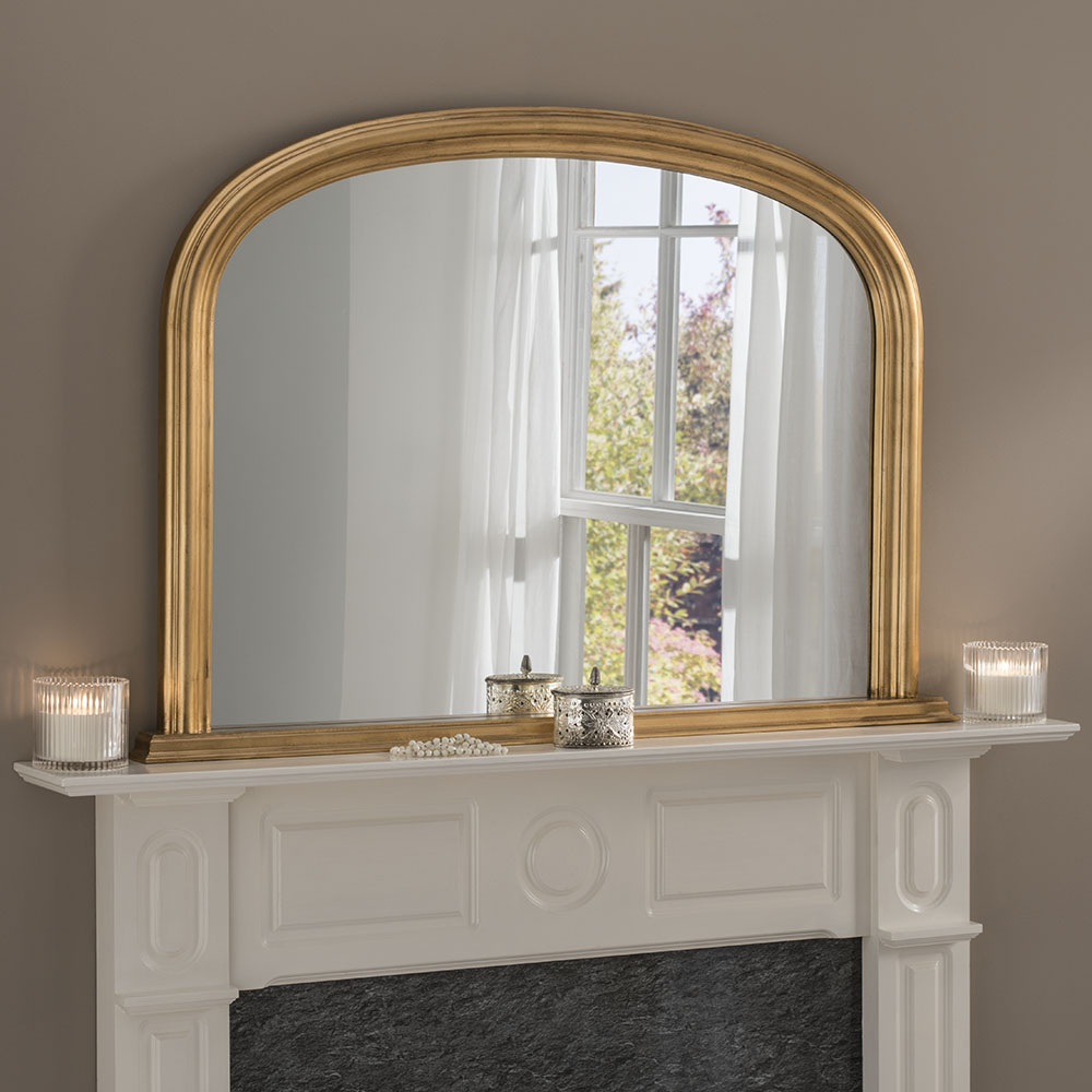 Brick Fireplace with Gold Frame Mirror