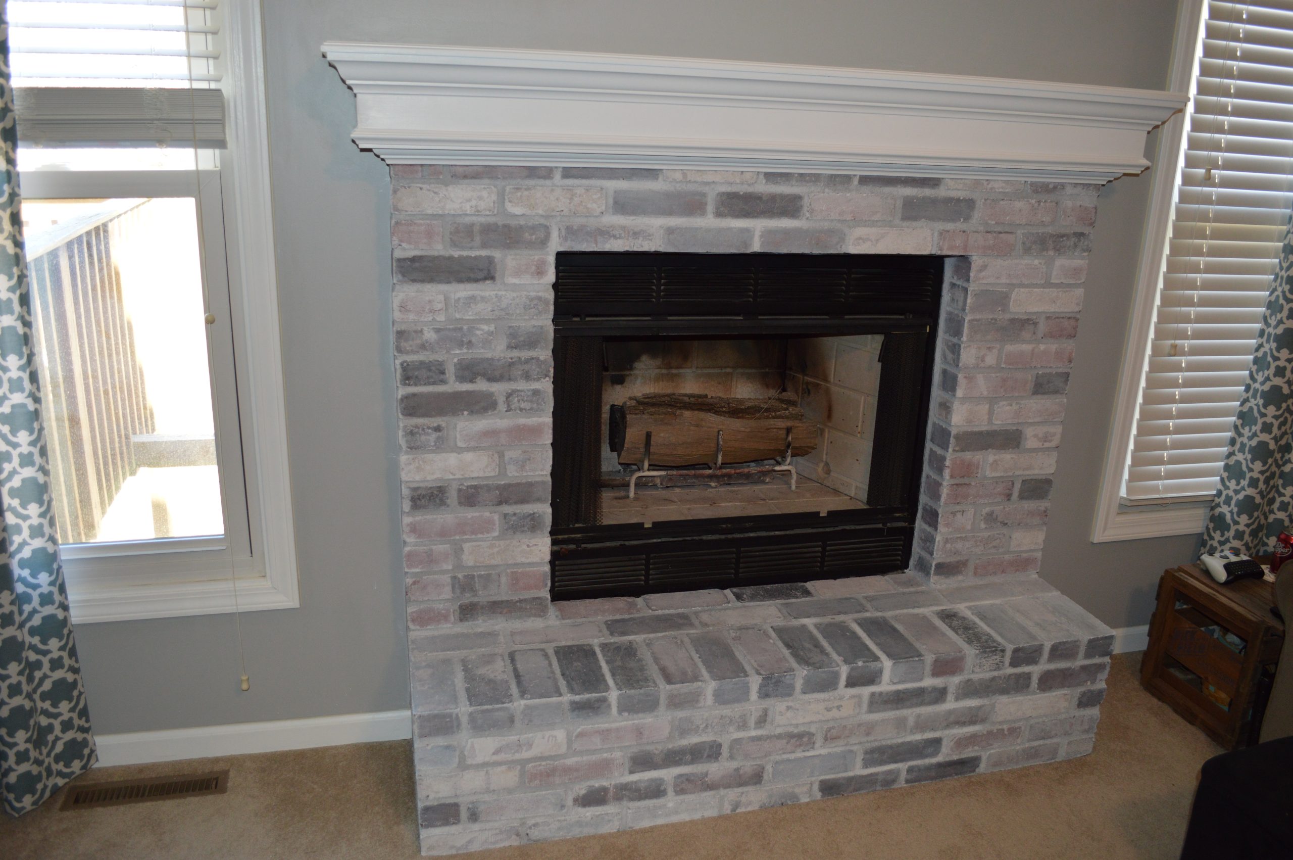 Limewash Brick Fireplace with White Mantel
