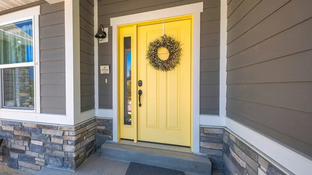 Lively Yellow Door on Gray Siding