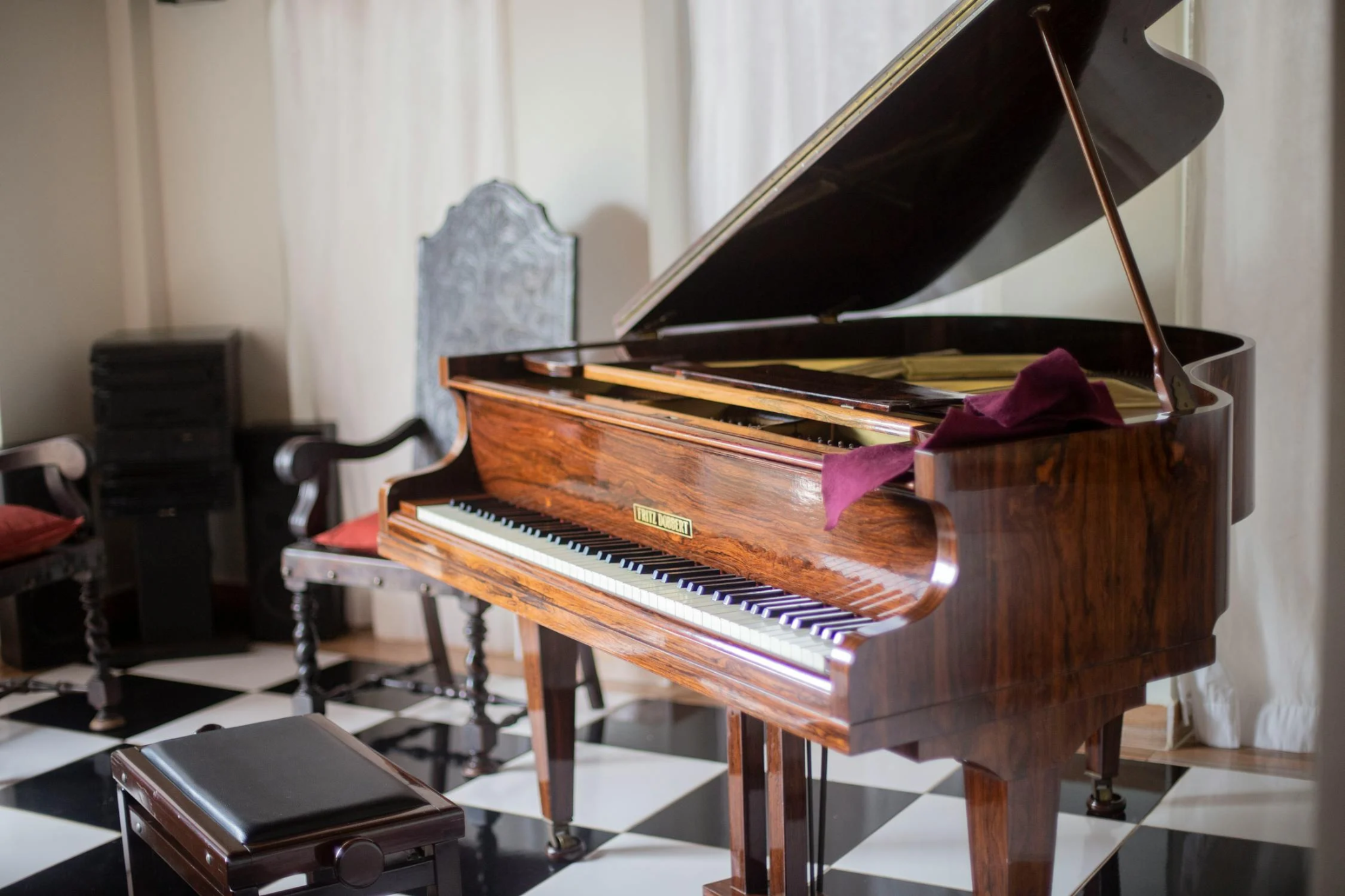 A grand piano being prepared for relocation