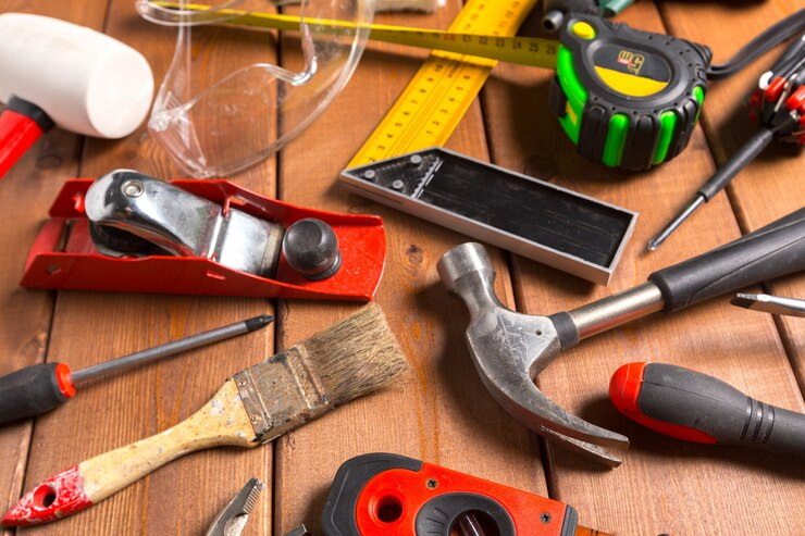 home repair tools on wooden surface