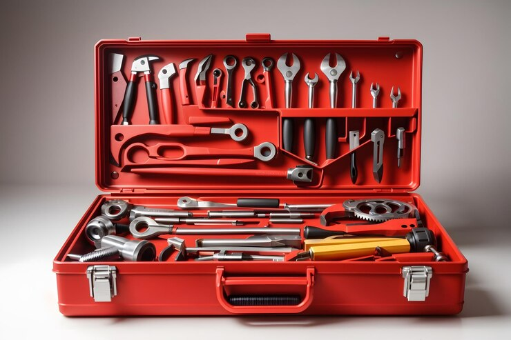 red tool case with pliers and wrenches