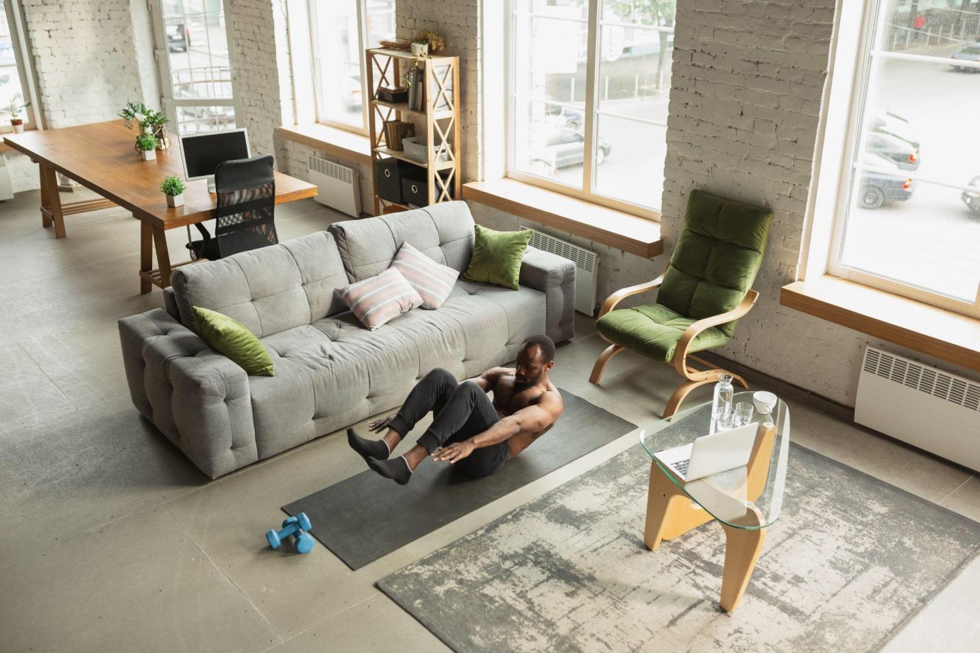 man exercising in living room