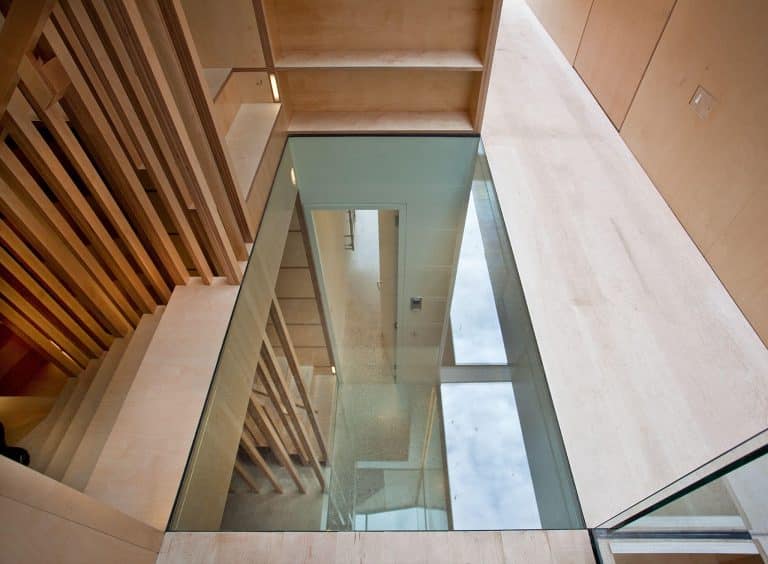 A glass floor, providing guests with a view of the rooms below