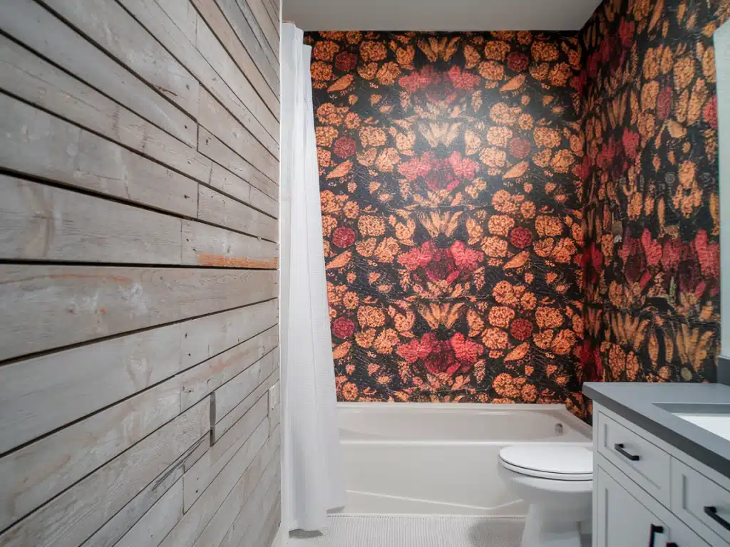 Horizontal shiplap with bold wallpaper on adjacent walls